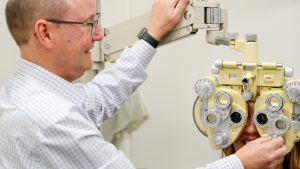 an eye examination using professional equipment